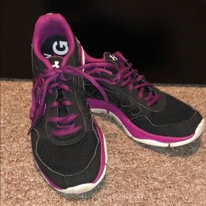 Black and purple Under Armour running sneakers.